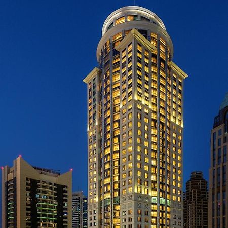 Dusit Hotel & Suites - Doha Exteriör bild The hotel at night